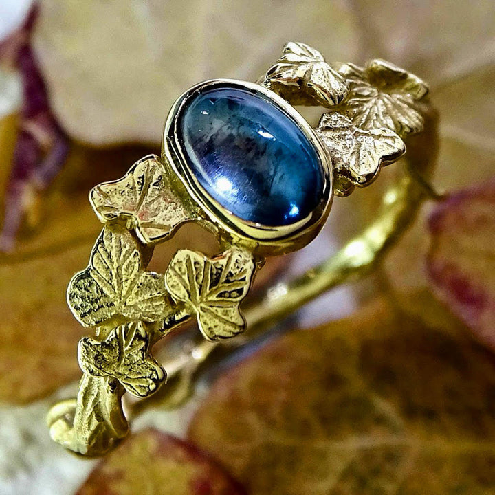 Entwining Ivy Leaves ring. 9ct gold, London Blue Topaz cabochon