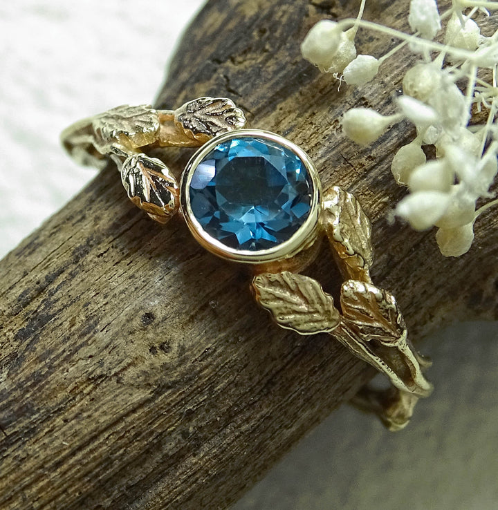 Entwining Leaves ring, London Blue Topaz, 5mm. 9ct gold
