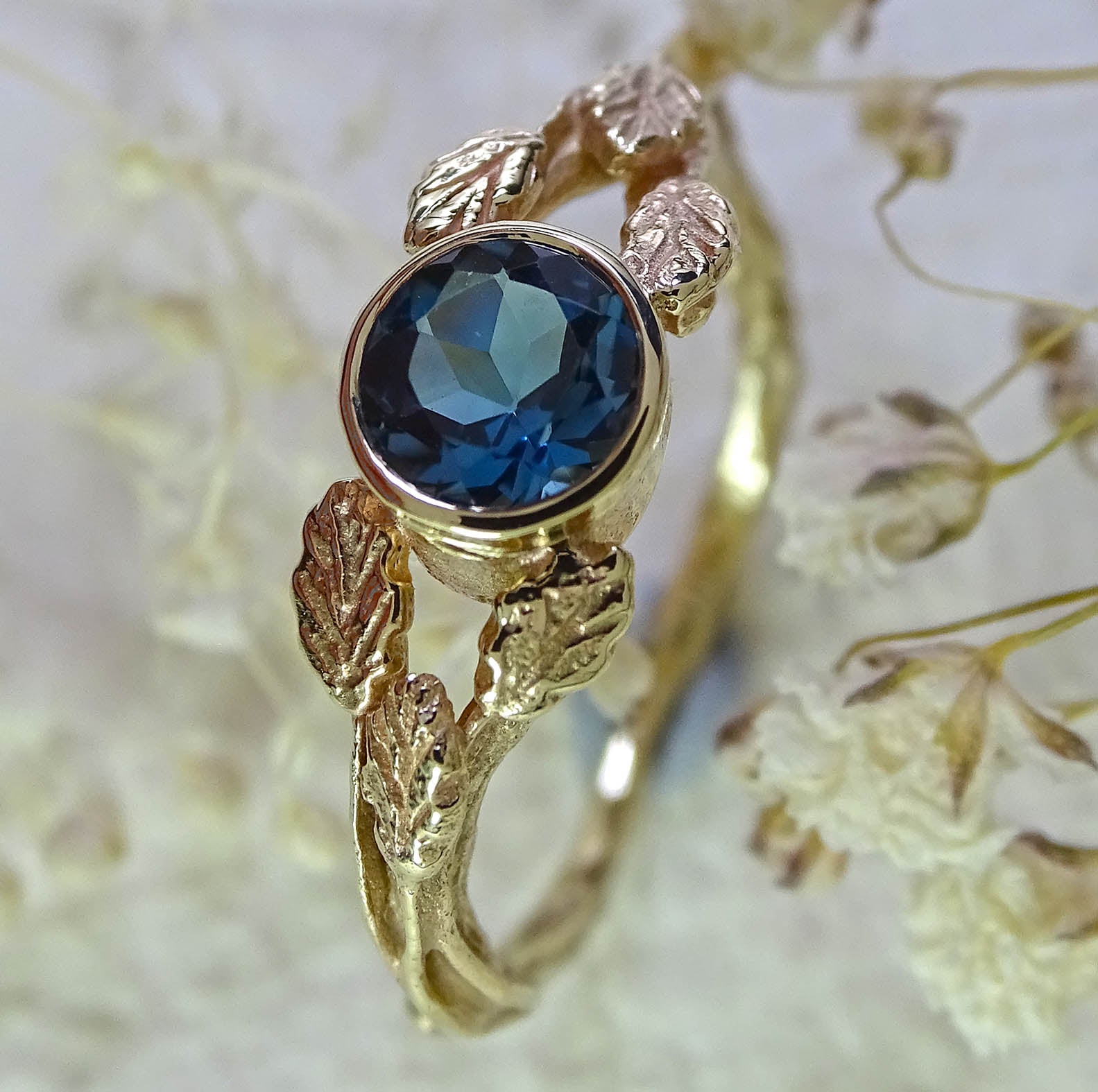 Entwining Leaves ring, London Blue Topaz, 5mm. 9ct gold