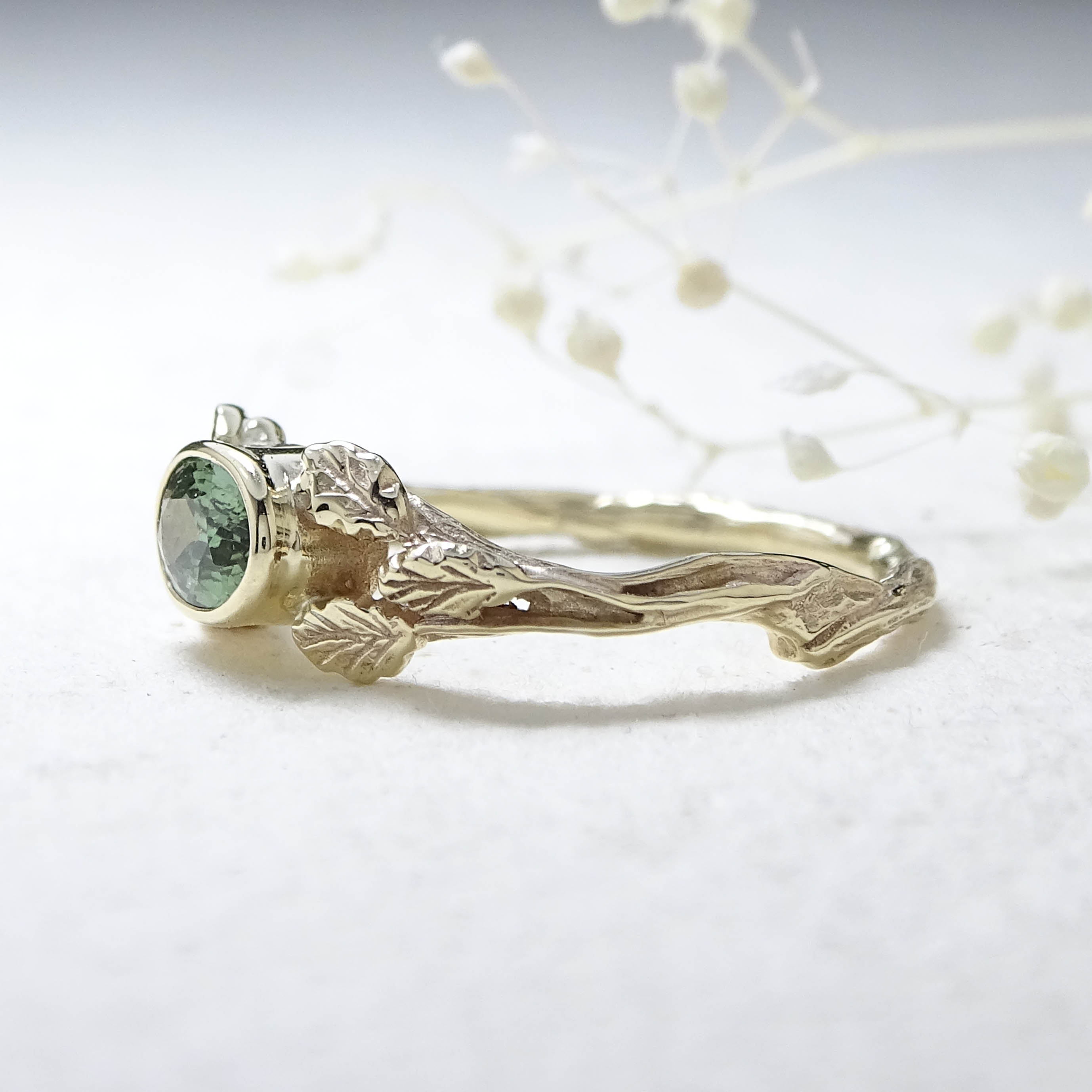 Entwining Leaves ring, 9ct yellow gold, 6mm x 4mm Green Sapphire