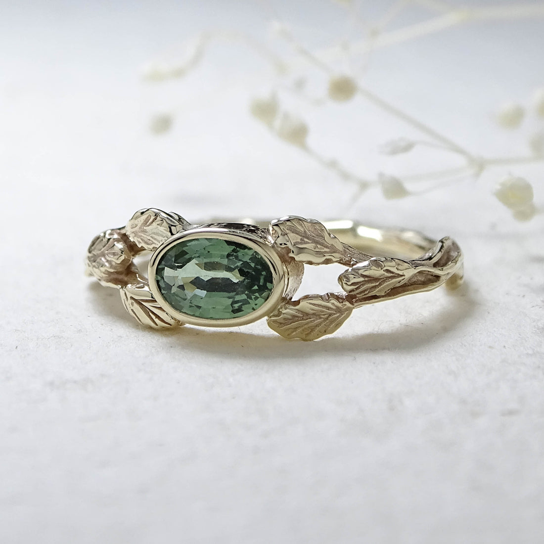 Entwining Leaves ring, 9ct yellow gold, 6mm x 4mm Green Sapphire