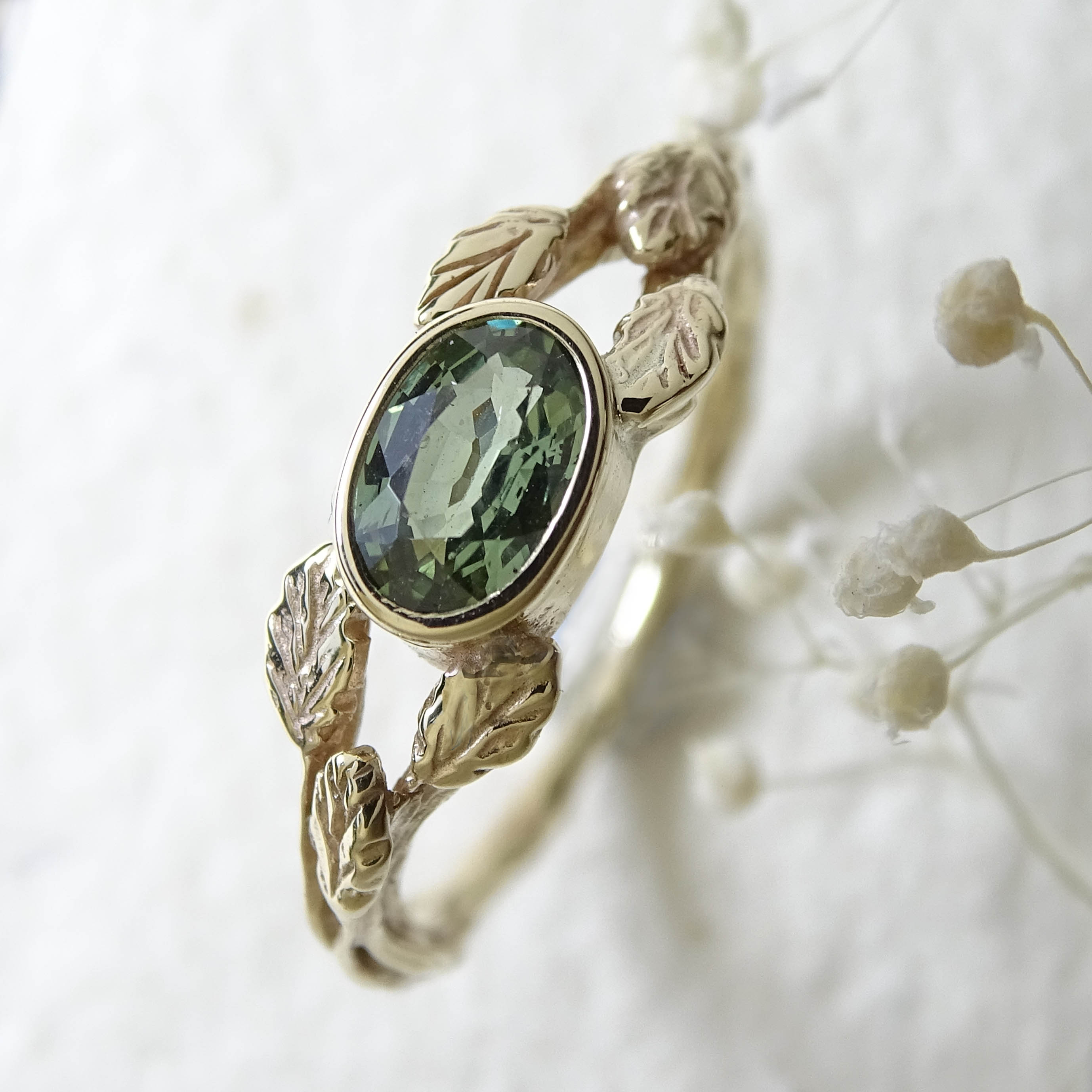 Entwining Leaves ring, 9ct yellow gold, 6mm x 4mm Green Sapphire