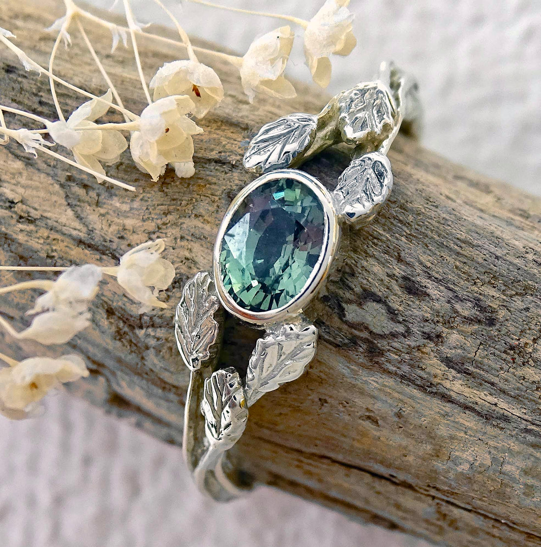 Entwining Leaves ring, 9ct white gold, 6mm x 4mm Green Sapphire